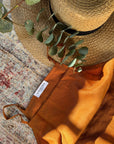 100% linen dress in a soft, natural hue, featuring a relaxed midaxi fit. Perfect for spring summer weather