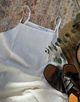 Classic white 100% linen dress in a soft, relaxed midaxi fit. Perfect for spring summer weather